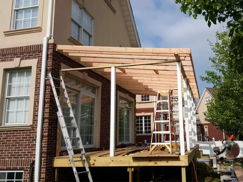 Exterior wood framing and deck structure under construction